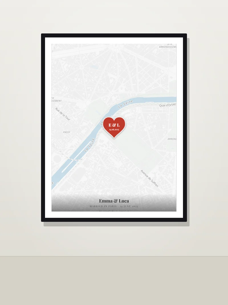 Paris, by the Eiffel Tower — framed wedding map poster on a wall